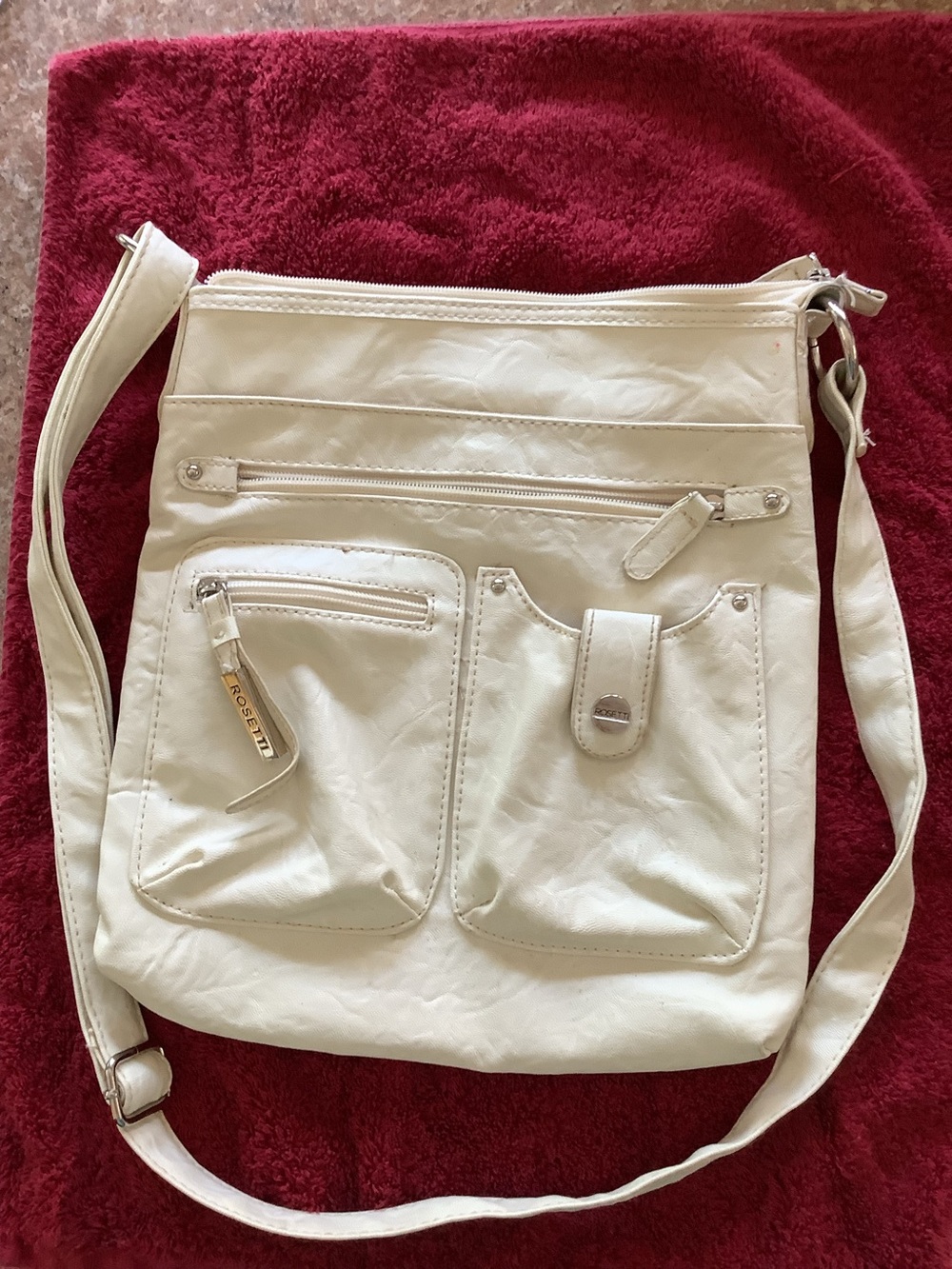 ROSETTI CREAM CROSSBODY BAG WITH MULTIPLE FRONT POCKETS